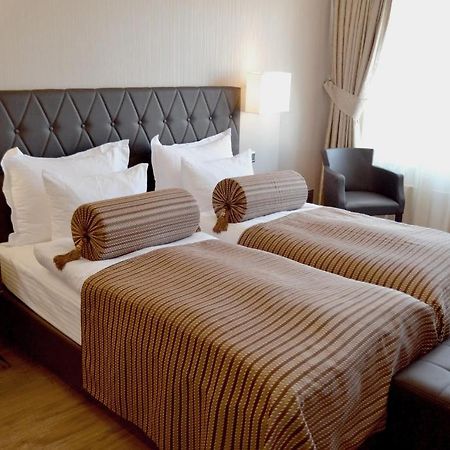 Hotel Vier Jahreszeiten Berlin City Berlim Quarto foto